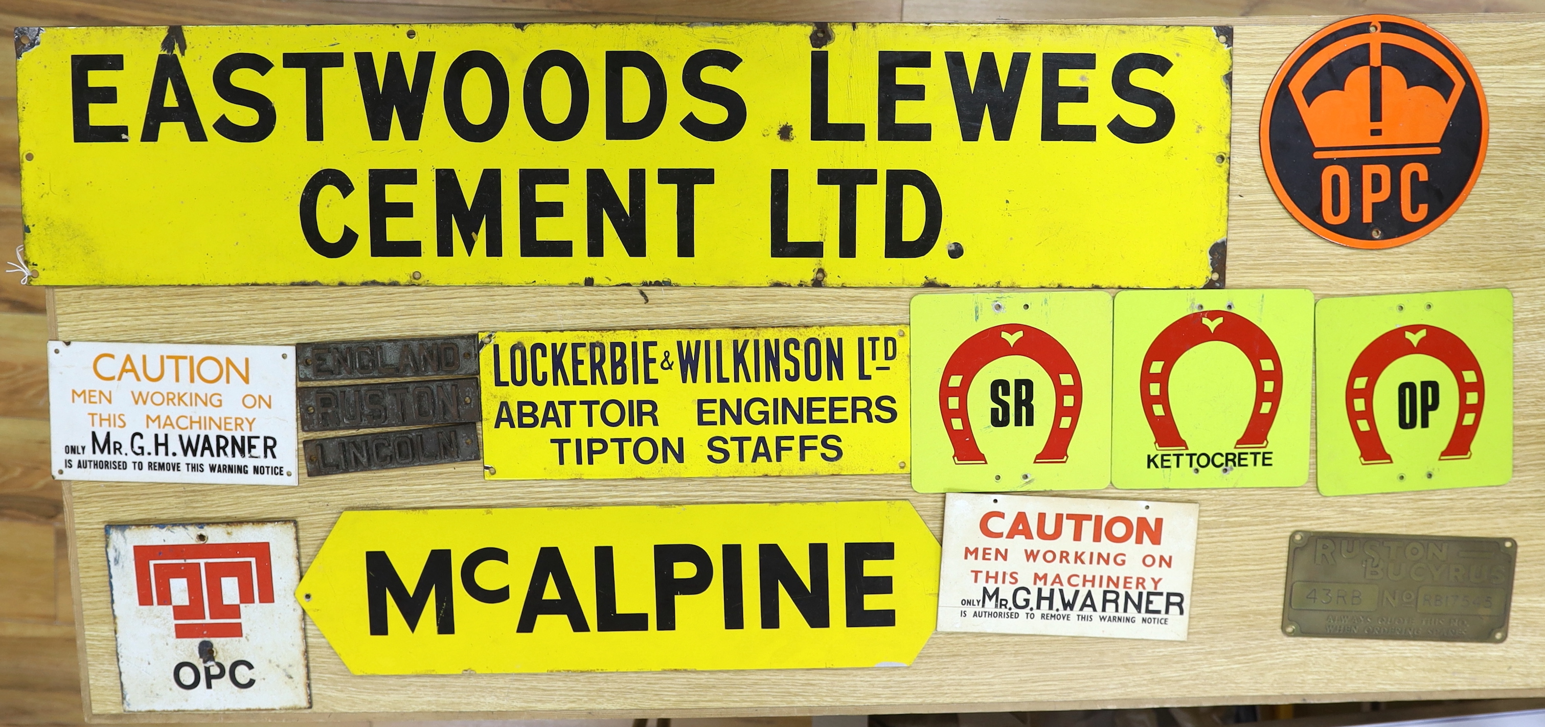 A group of enamel and other signs, including Eastwoods Lewes cement Ltd, McAlpine etc. largest 23x107cm